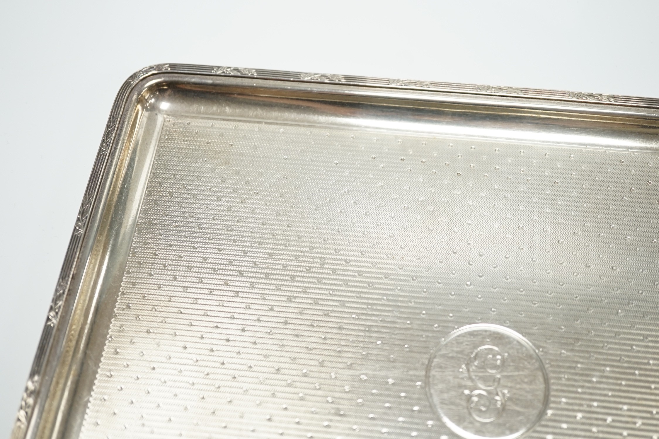 A George V engine turned silver dressing table tray, by Mappin & Webb, London 1915, 27.5cm, 15.3oz.